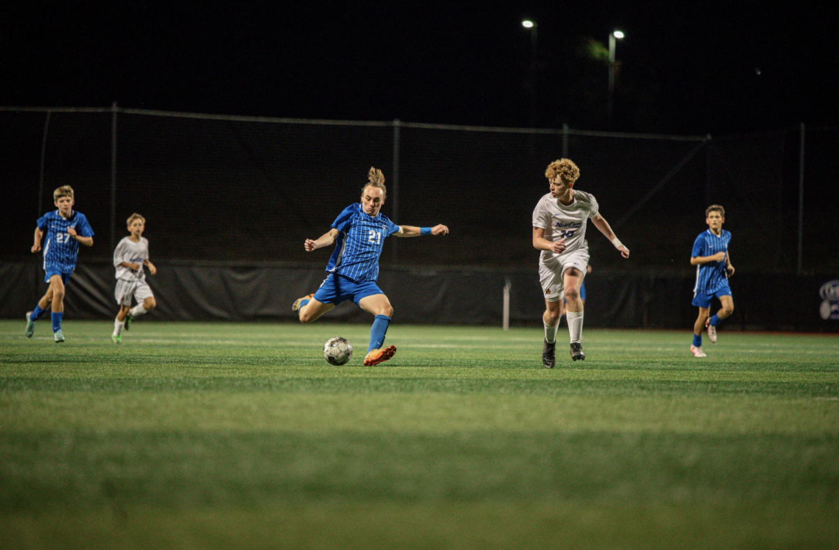 Sam Arnold (12) takes a shot on the goal. 